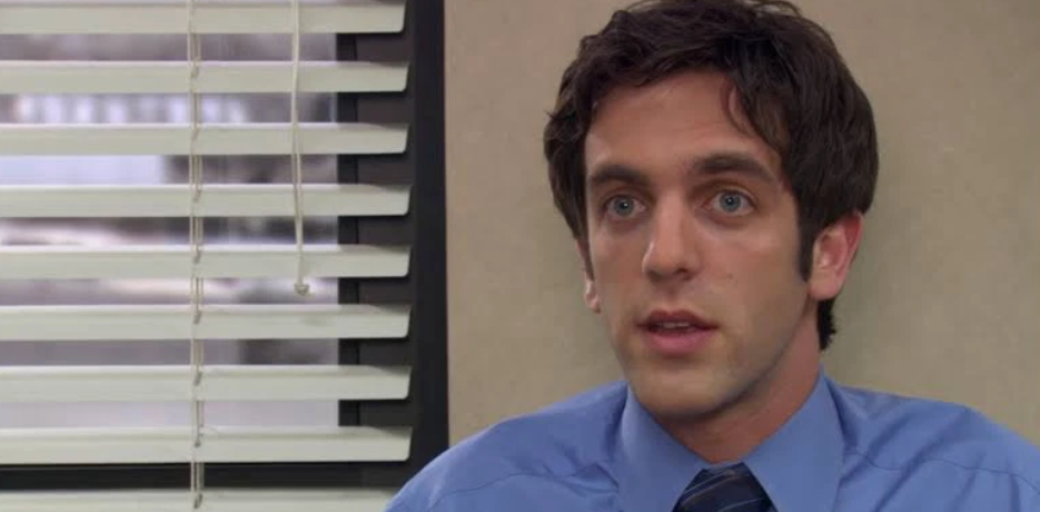 B.J. Novak as Ryan Howard in The Office, sporting a charming expression. 