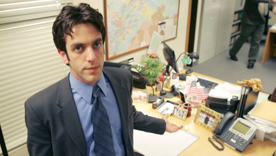 B.J. Novak as Ryan Howard in The Office, deep in thought, with a focused and intense expression.