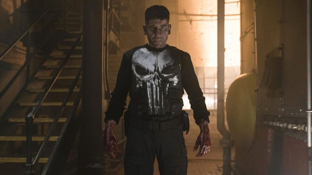 Jon Bernthal looking serious with bloodied hands in The Punisher