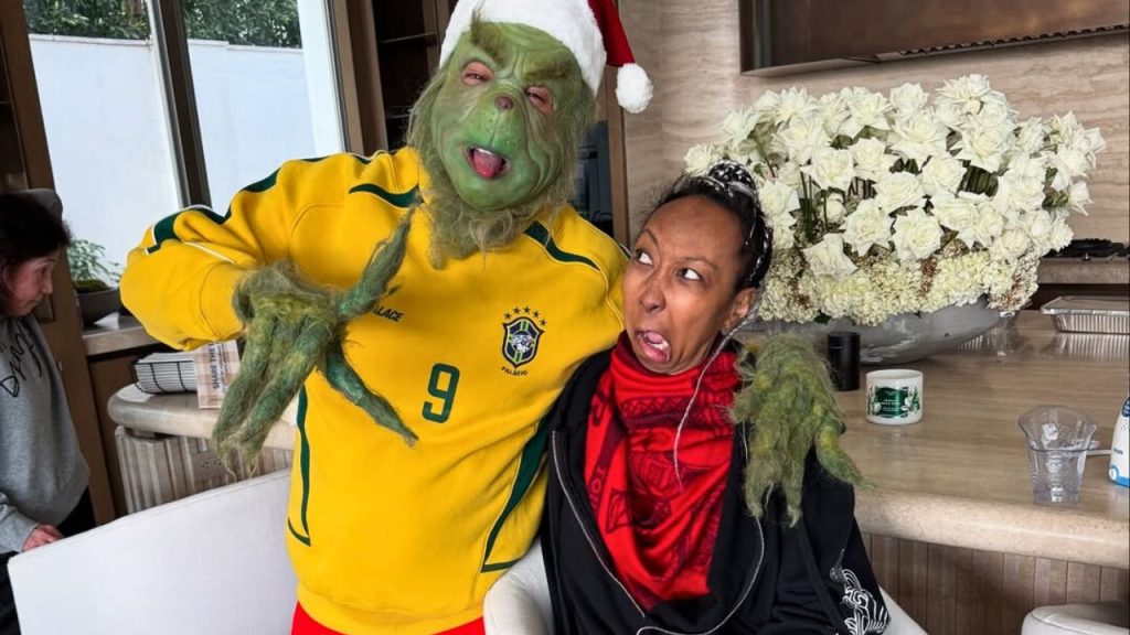 Tyga dressed as Grinch with Pasionaye Nguyen 