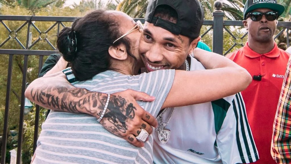 Tyga hugging his mother Pasionaye Nguyen 