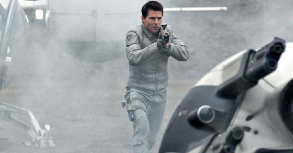 Tom Cruise shooting a gun in Oblivion