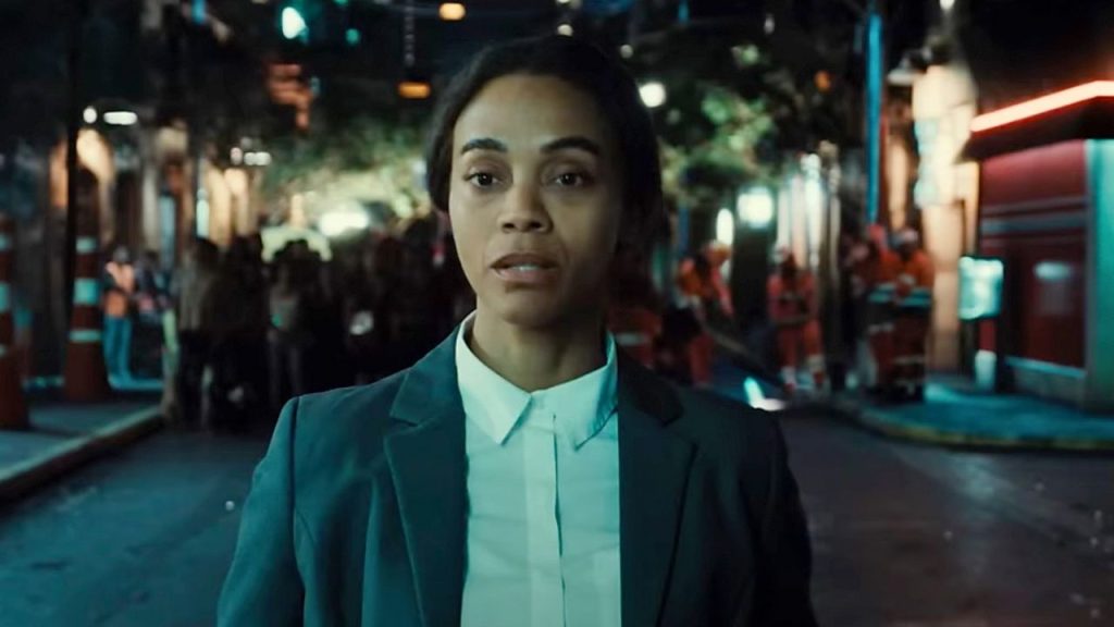 Zoe Saldaña looking worried while walking on the street in Emilia Pérez