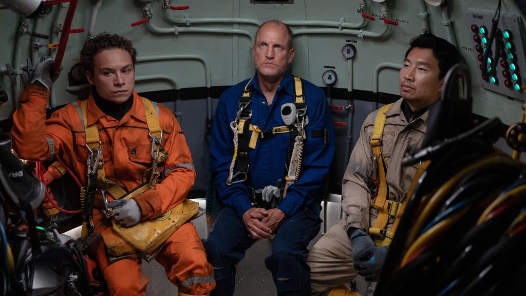 (l-r.) Finn Cole stars as Chris Lemons, Woody Harrelson as Duncan Allcock and Simu Liu as Dave Yuasa LAST BREATH, a Focus Features release.