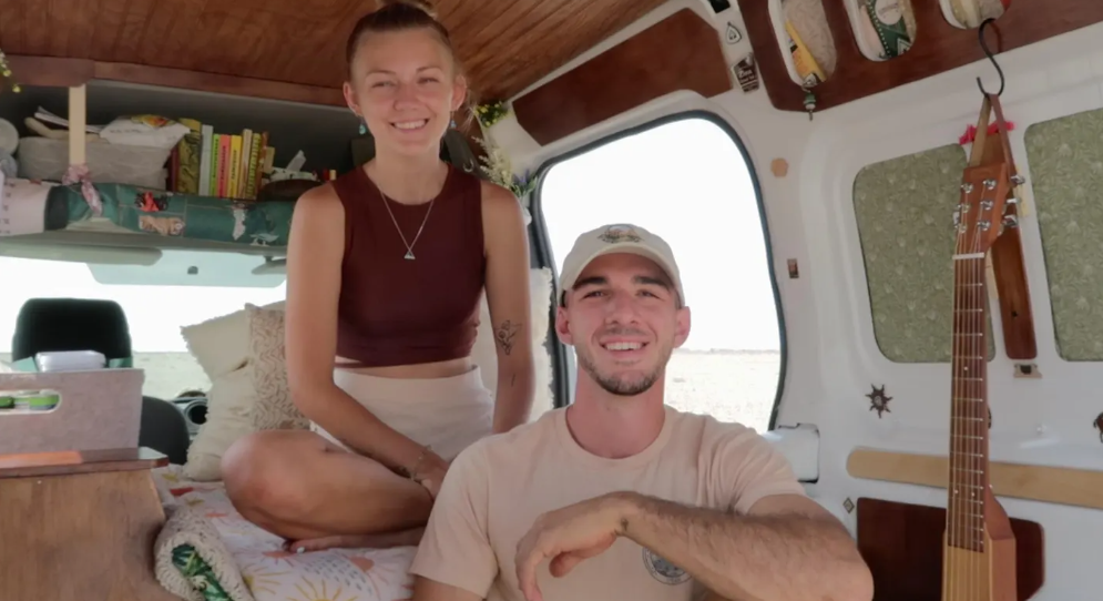 Gabby Petito and Brian Laundrie sitting together in a van during their #vanlife journey.