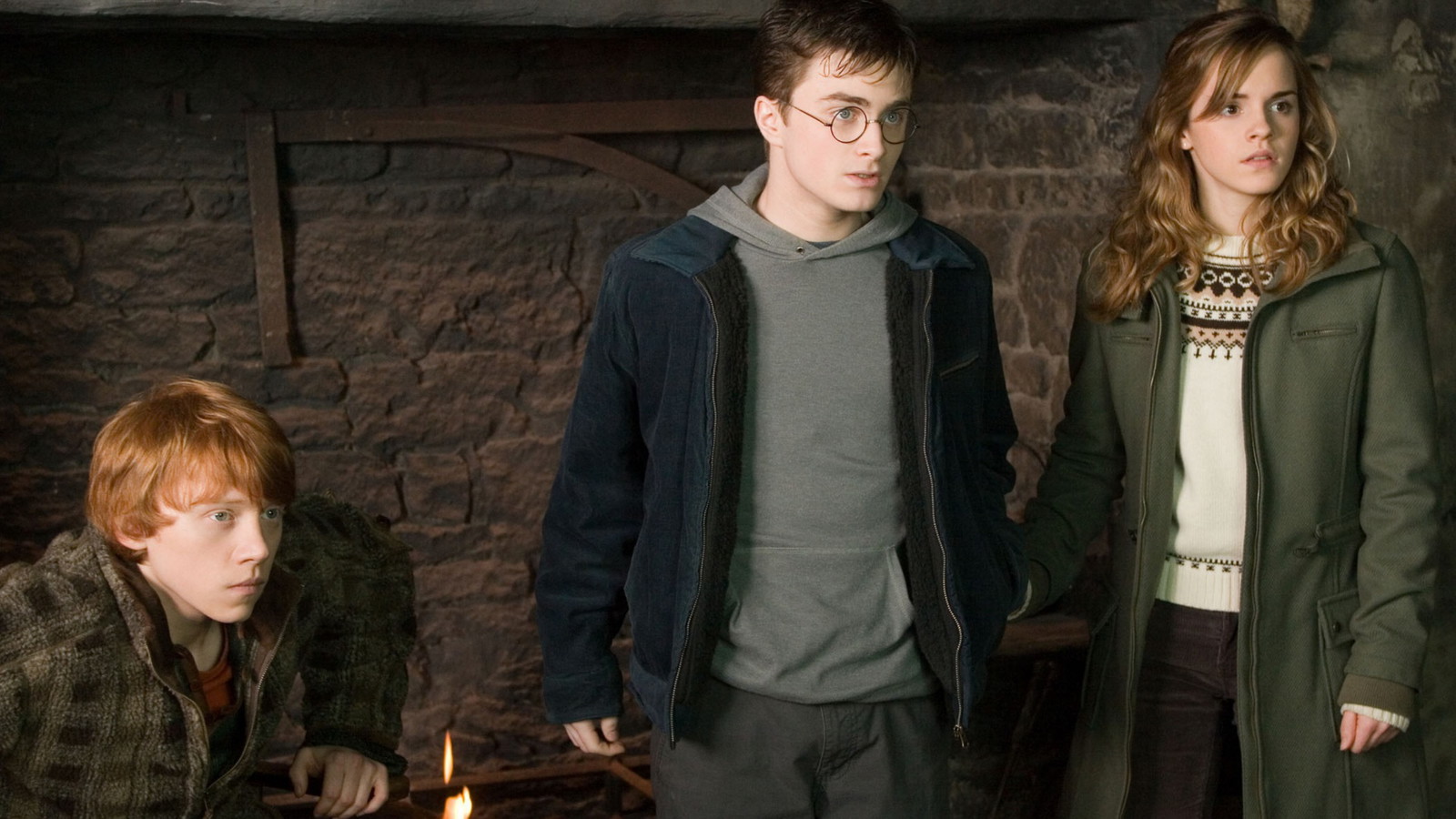 Harry, Hermoine, and Ron look surprised in a still from Harry Potter movie