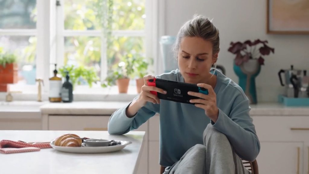 A close-up of Captain Marvel star Brie Larson with Nintendo Switch console in hand.