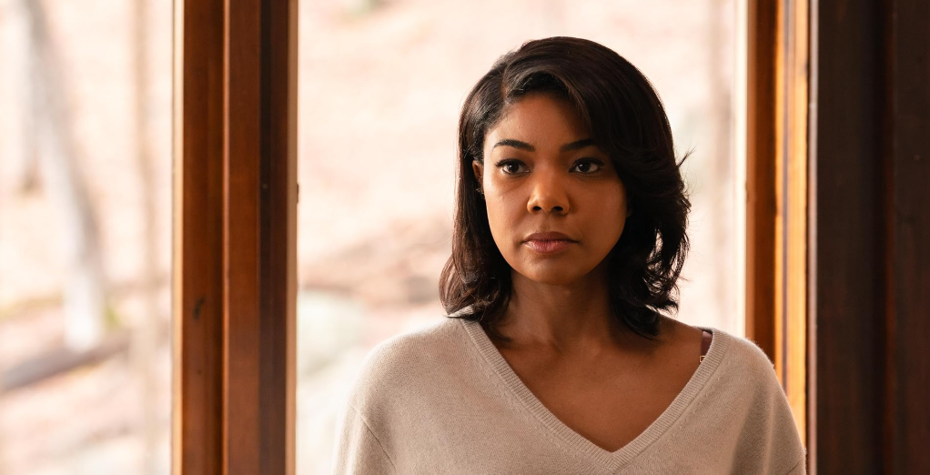 Gabrielle Union in Riff Raff, looking tense and concerned, with a serious expression on her face.