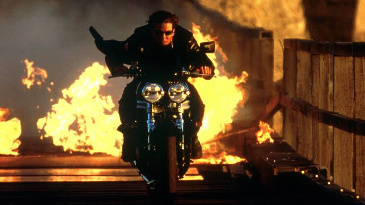 Tom Cruise doing his epic bike stunt in Mission: Impossible 2