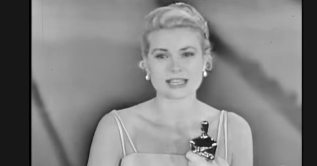 Grace Kelly holding the Oscar she won. 