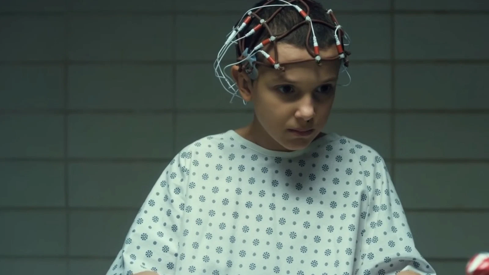 Millie Bobby Brown as Eleven with her shaved head in Stranger Things