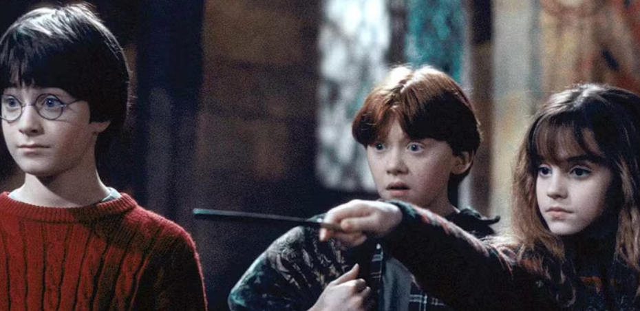 A scene from the Harry Potter movies featuring Harry, Ron and Hermione.