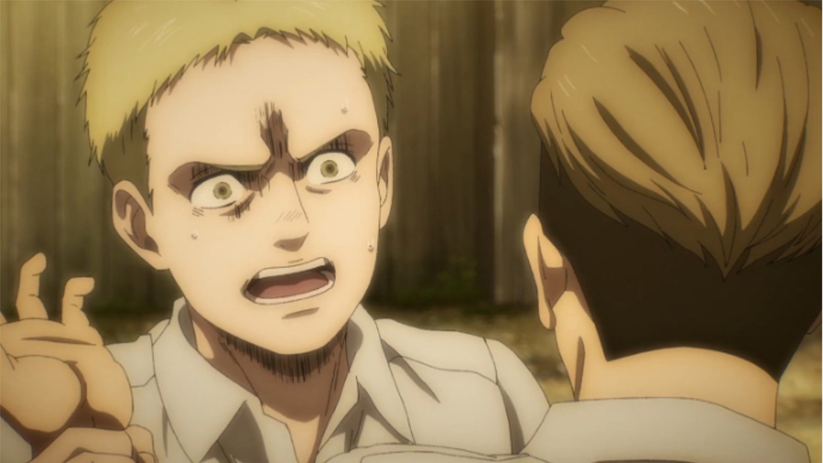 Young Reiner looks angry in a still from Attack on Titan theory 