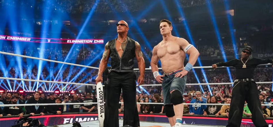 John Cena stands in the wrestling ring alongside The Final Boss.