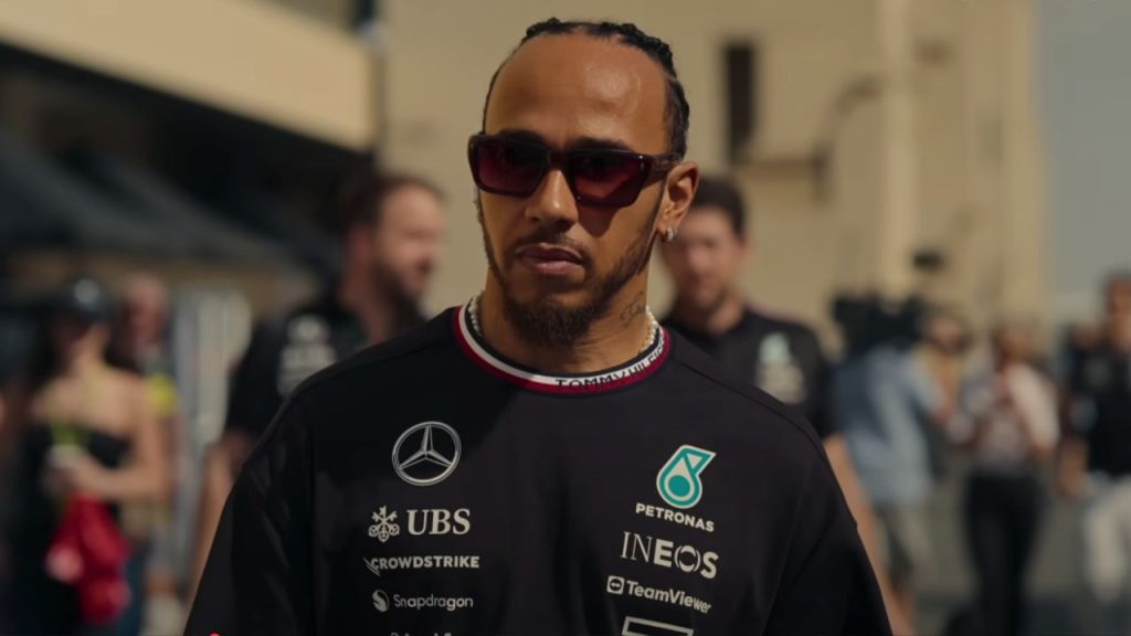 Lewis Hamilton standing in front of people in Formula 1: Drive to Survive 