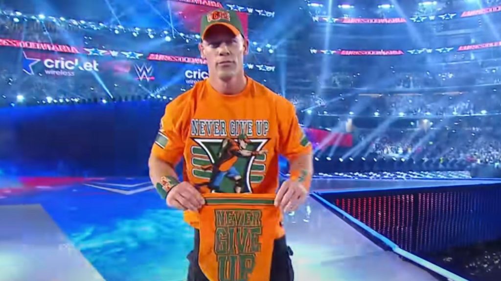 Cena wearing an orange t-shirt and cap in WrestleMania 32