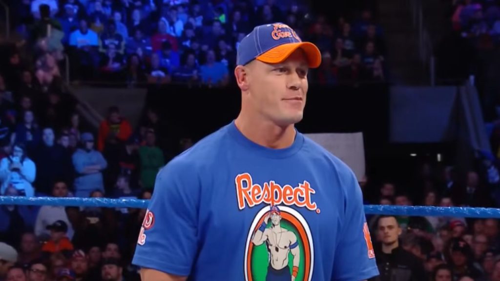 Cena wearing a blue shirt with his picture and the word "Respect" in SmackDown LIVE.