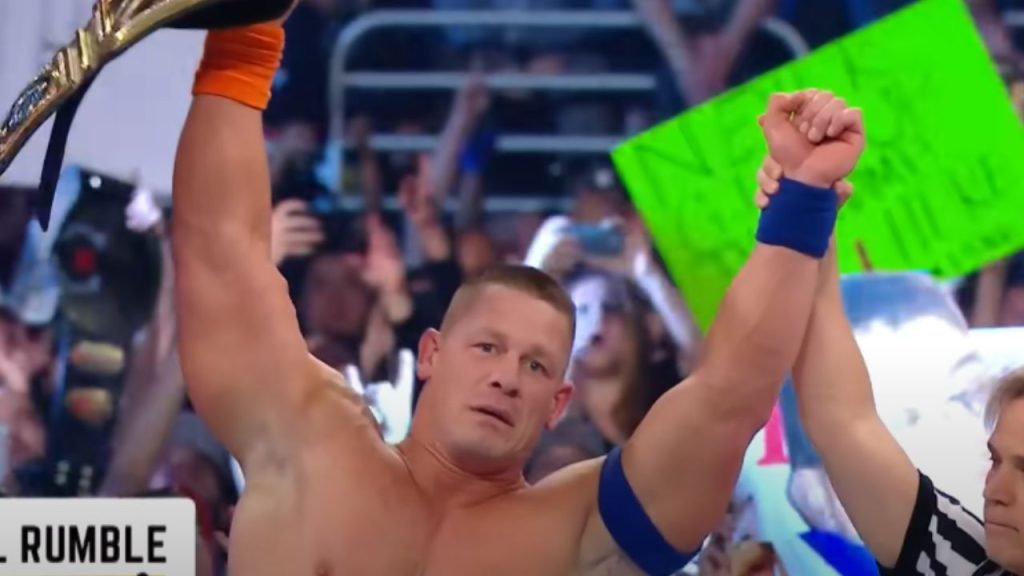 Cena showing his champion's belt