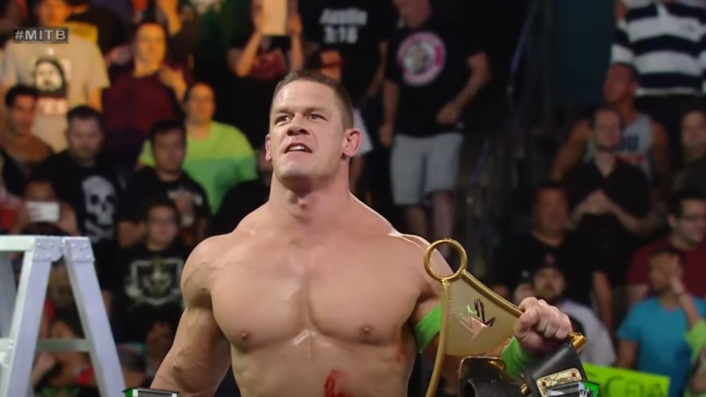 A victorious Cena taunting the crowd in Money in the Bank 2014