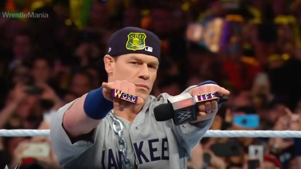 Cena wearing knuckledusters with the words "Word" and "Life" in WrestleMania 35