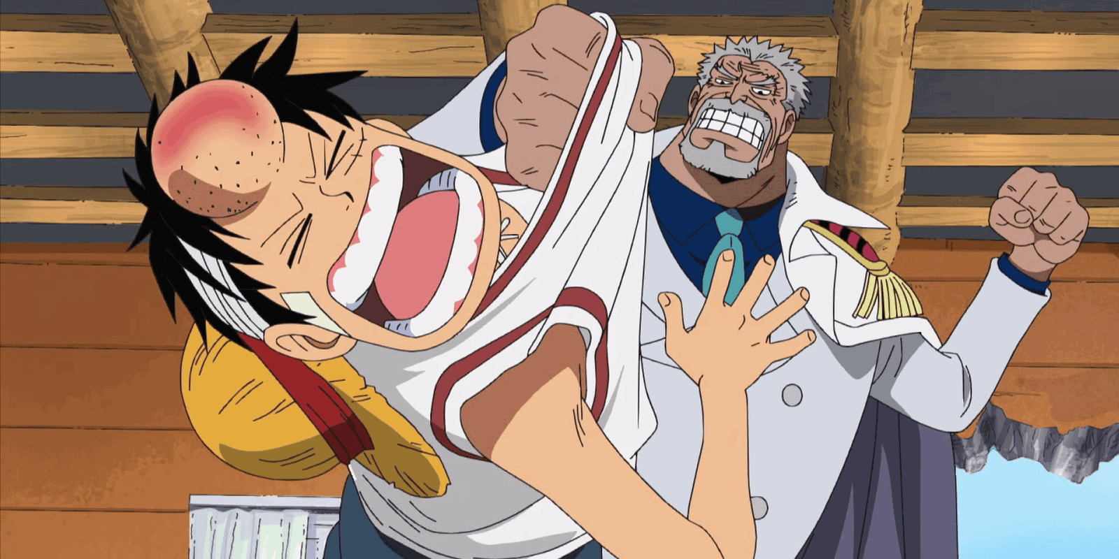 Garp beats up Luffy after reuniting in One Piece.