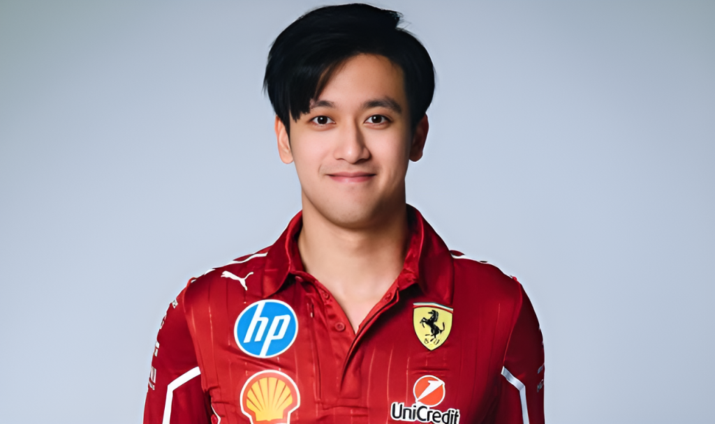 Zhou Guanyu in a studio portrait wearing Ferrari red team gear with sponsor logos including HP, Shell and UniCredit.