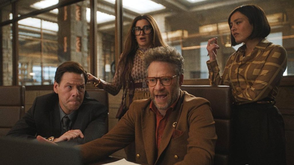 Ike Barinholtz, Seth Rogen, Kathryn Hahn, and Chase Sui Wonders looking worried after watching a laptop screen in The Studio