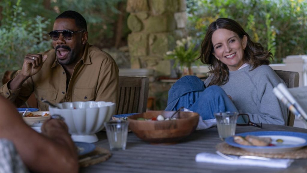 Colman Domingo and Tina Fey smiling while eating in The Four Seasons