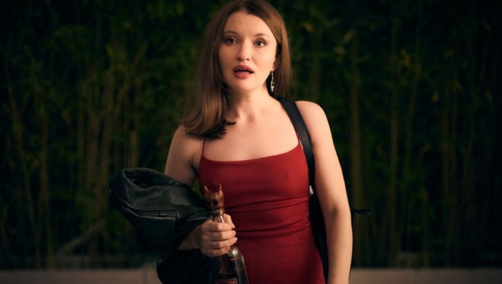 Emily Browning in a stunning red dress, exuding confidence and charm in a scene from 'One More Shot.