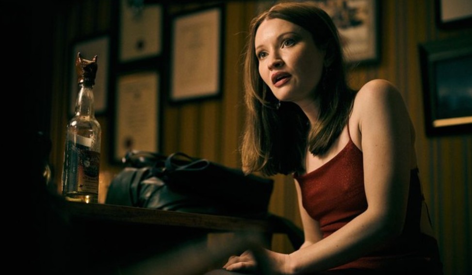 Emily Browning is looking uneasy or uncomfortable in a scene from 'One More Shot.'