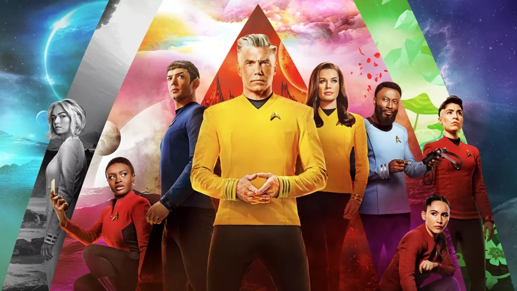 The cast of Star Trek: Strange New Worlds in a promotional poster with Captain Pike (in gold uniform) at center, surrounded by diverse crew members including Spock and Number One, with colorful planetary backgrounds forming a triangular composition.