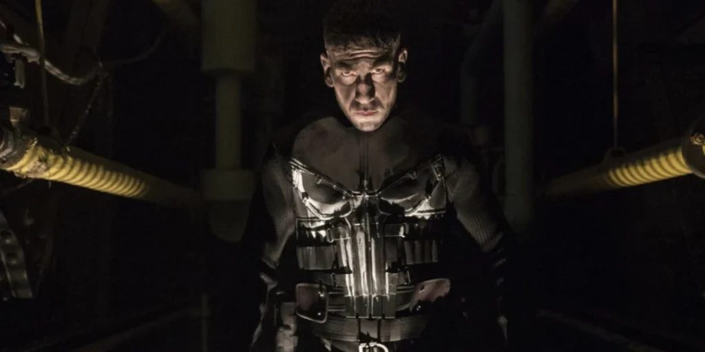 Jon Bernthal wearing the iconic skull motif as Frank Castle in a still from the show The Punisher.