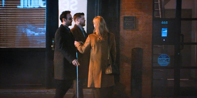 Matt, Karen, and Foggy exit their law firm that displays the number 468.