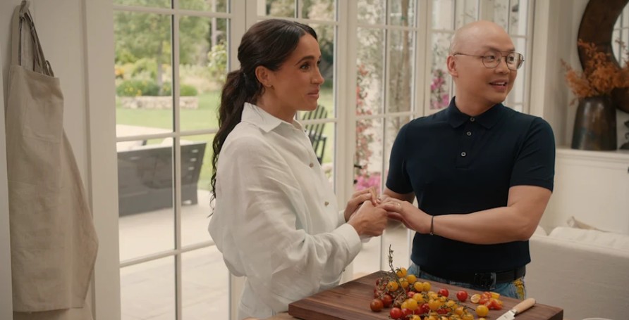 Meghan Markle and Daniel Martin are sharing a conversation in the kitchen.