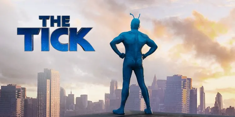 The logo and promotional image for The Tick TV series, showing Peter Serafinowicz as The Tick in his blue superhero costume with antennae, standing with hands on hips against a city skyline at sunset.