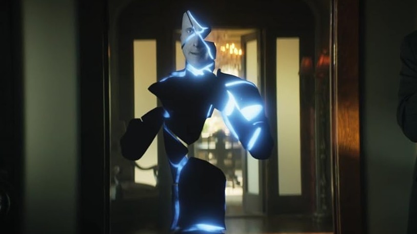 Mr. Nobody from Doom Patrol in his energy form, standing in a doorway with a dark silhouette and bright blue electrical energy outline.