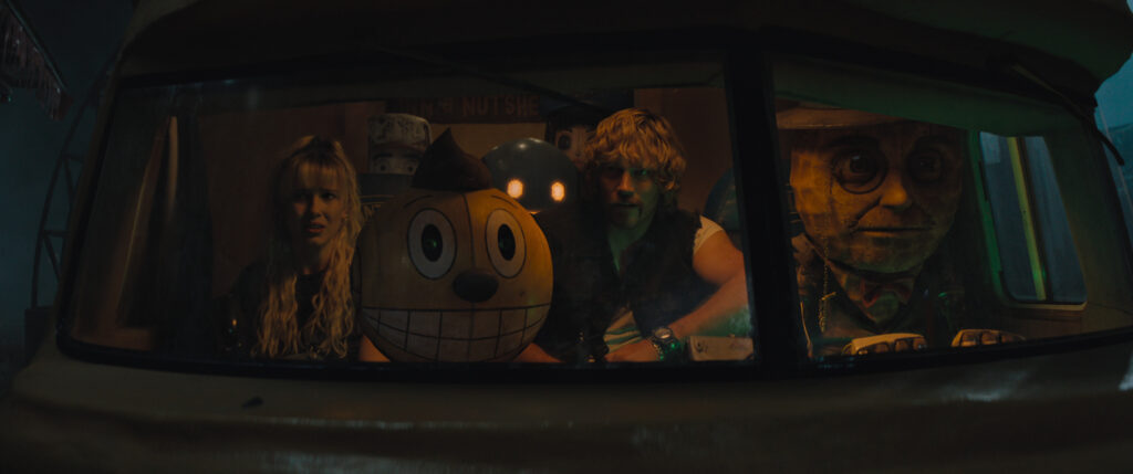 (L to R) Michelle (Millie Bobby Brown), Cosmo (voiced by Alan Tudyk), Herman (Voiced by Anthony Mackie) Keats (Chris Pratt) and Mr. Peanut (voiced by Woody Harrelson) in The Electric State.