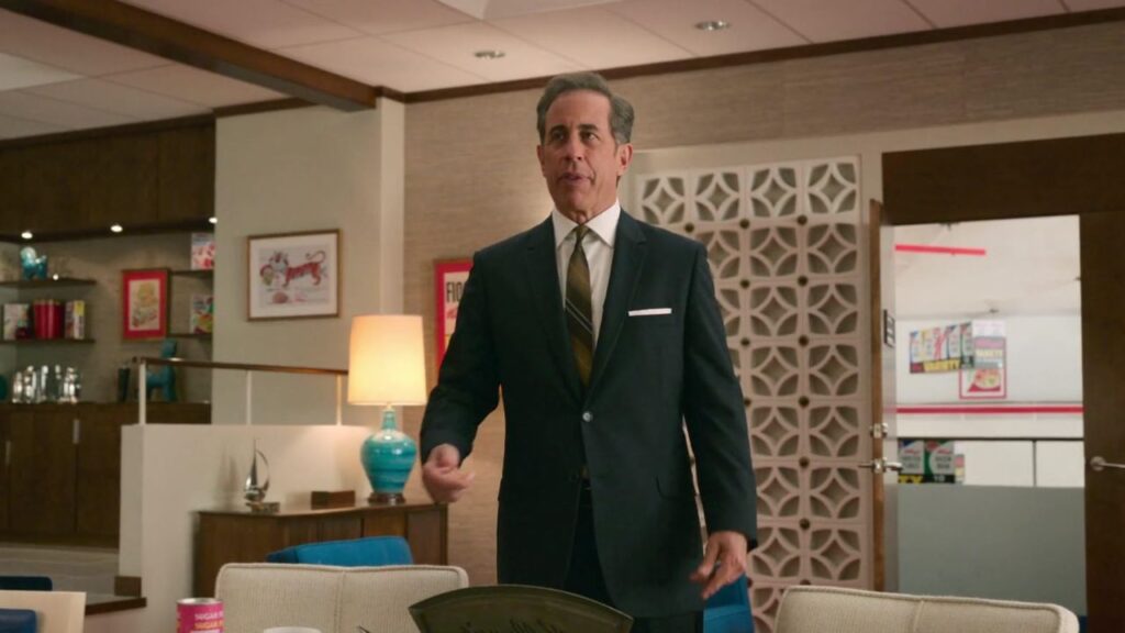 Jerry Seinfeld wearing a suit in Unfrosted