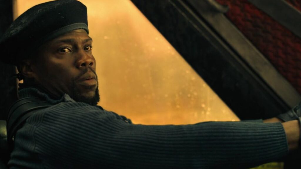 Kevin Hart wearing a beret and driving a car in Borderlands