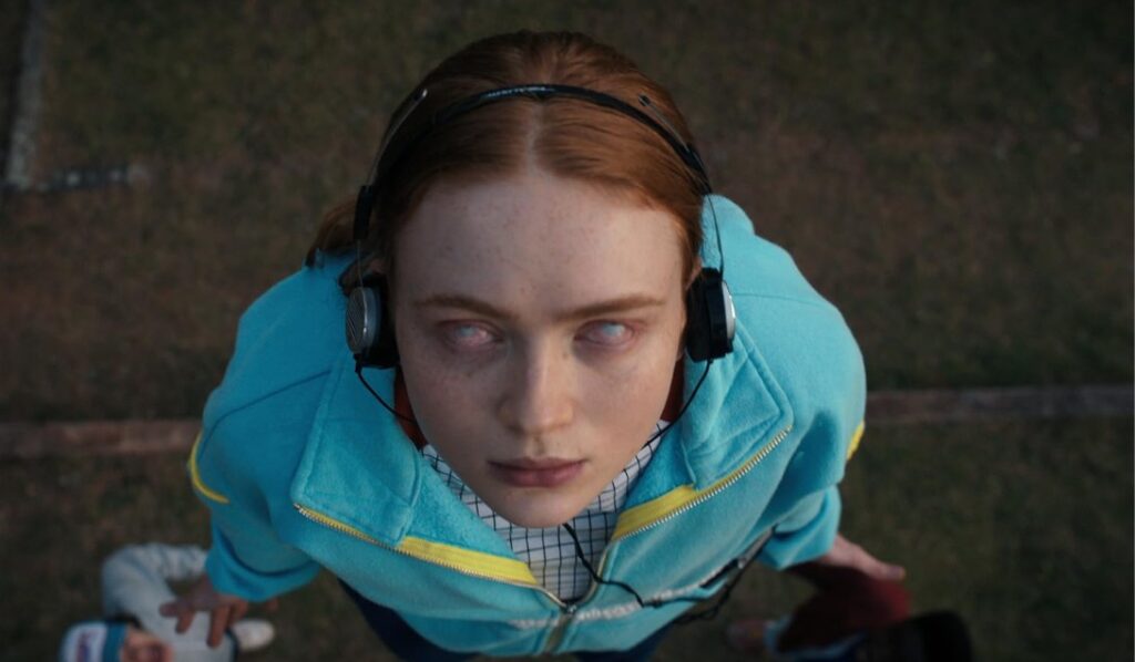 8 Unanswered Questions That Will Haunt Us Until ‘Stranger Things’ Season 5 33 Sadie Sink as Max Mayfield in a chilling still from Stranger Things, looking possessed during a tense moment.