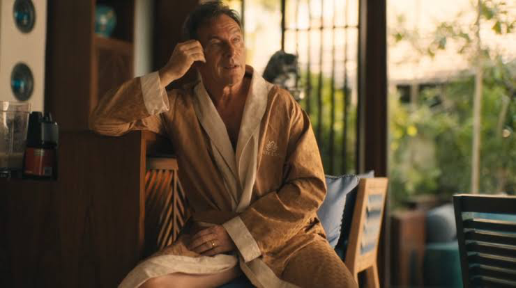 Jason Isaacs wearing a bathrobe in The White Lotus 