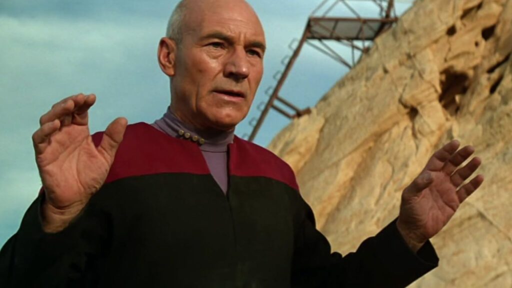 Patrick Stewart raising his hands up in Star Trek: Generations