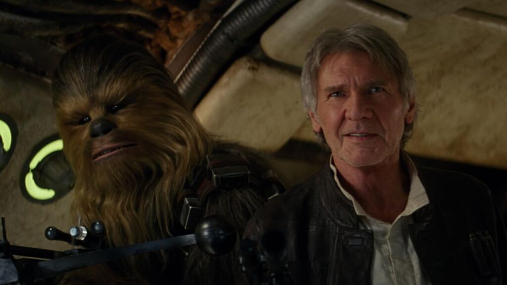 Harrison Ford and Peter Mayhew smiling together in Star Wars: Episode VII - The Force Awakens