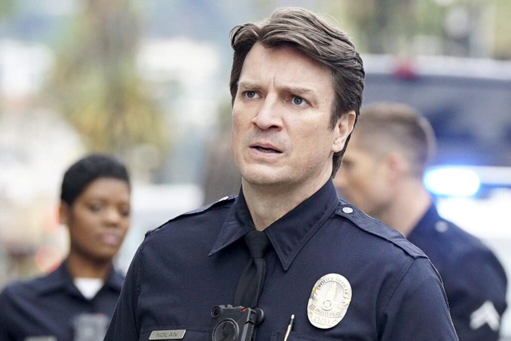 Afton Williamson and Nathan Fillion in a still from The Rookie