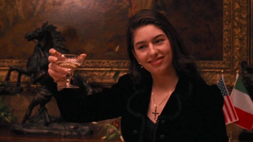 Sofia Coppola raising her glass in The Godfather Part III