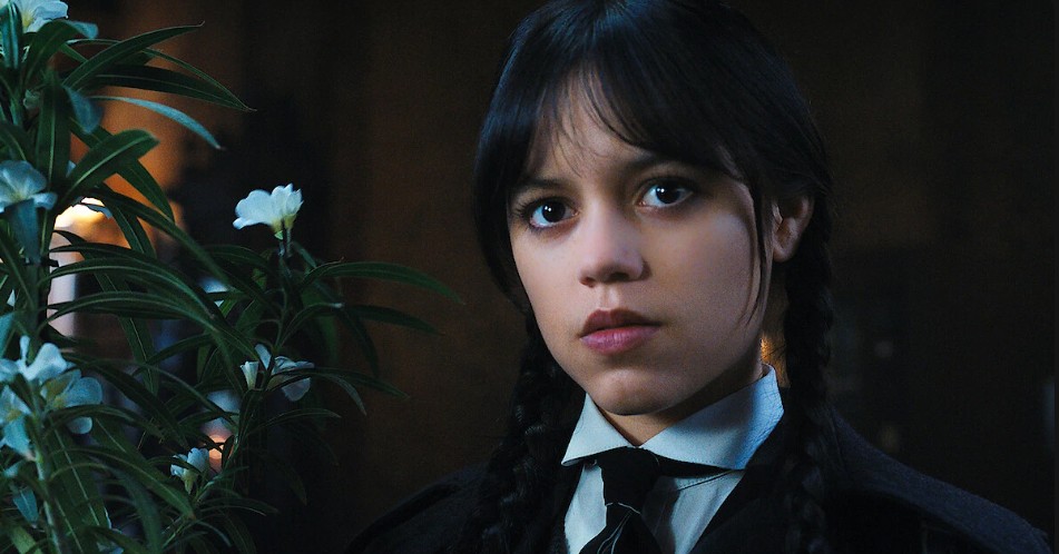 Jenna Ortega as Wednesday Addams, is exuding confidence with a determined expression.