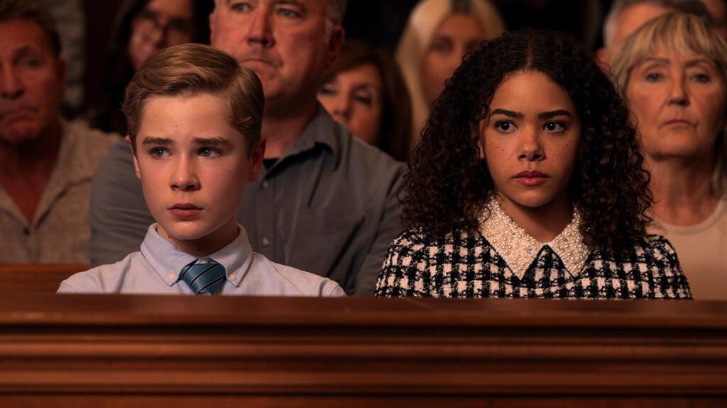 A still from Ginny and Georgia featuring Austin and Ginny in court 