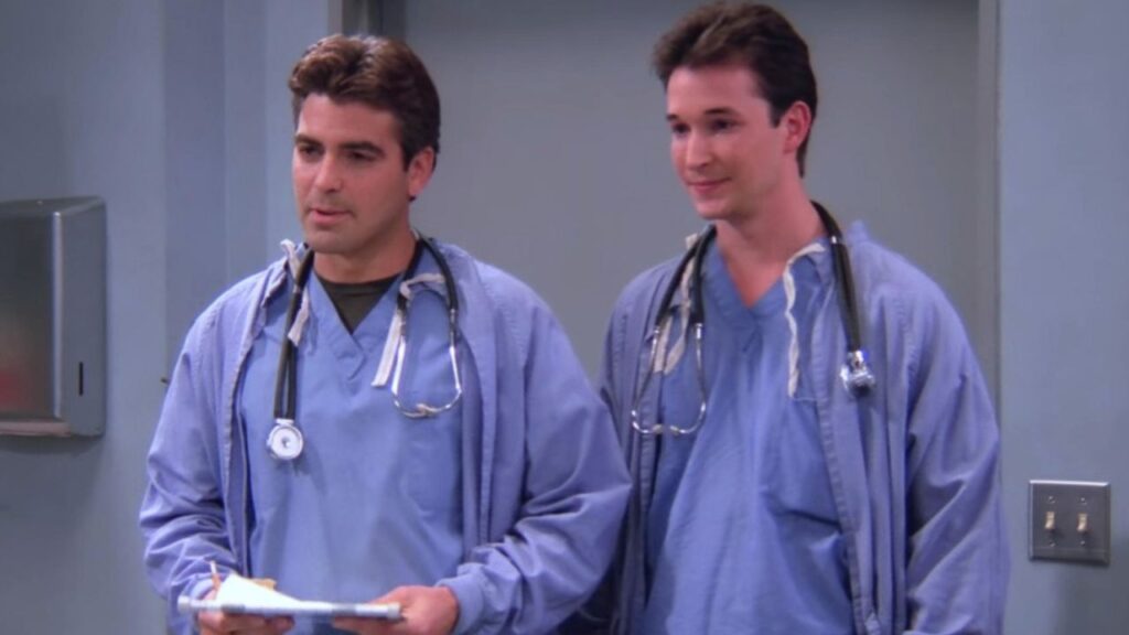 Noah Wyle Reveals George Clooney’s ‘ER’ Secret After He Had Trouble Remembering His Own Lines 1 George Clooney and Noah Wyle dressed in doctor suit in Friends