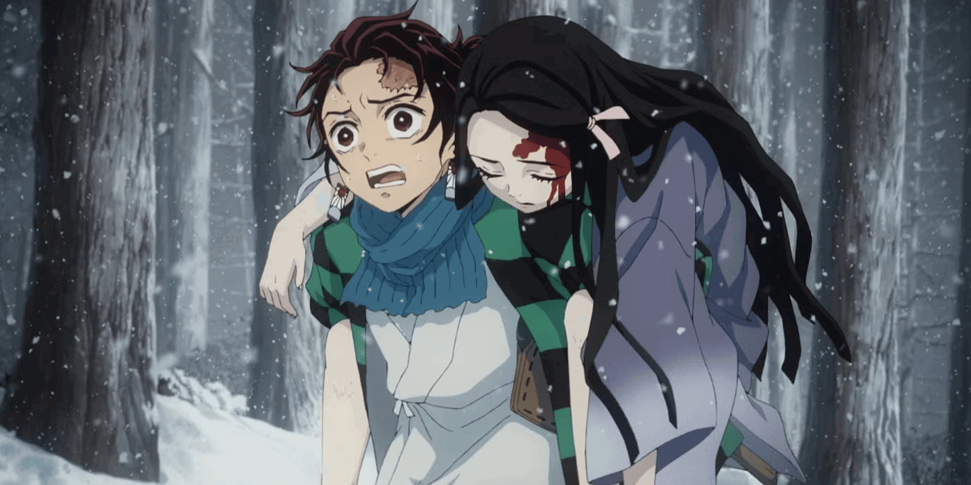 Tanjiro carries an injured Nezuko in Demon Slayer. 