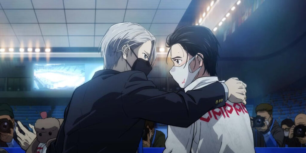 Yuri Katsuki and Victor Nikiforov embracing each other before the press in Yuri!!! on Ice.
